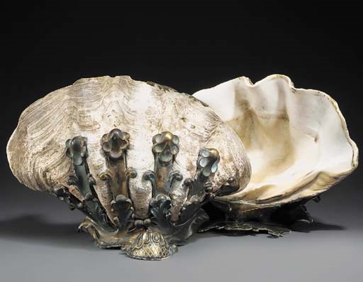 A pair of bronze mounted clam shells, the mounts early 20th century