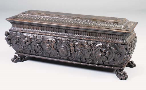 AN ITALIAN CARVED WALNUT CASSONE, 17TH CENTURY