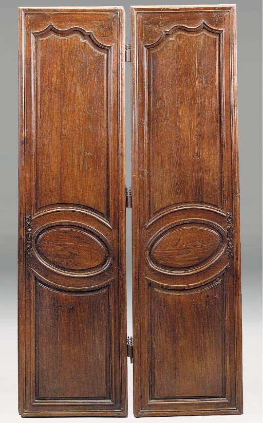 A PAIR OF LOUIS XIV/REGENCE OAK ARMOIRE DOORS