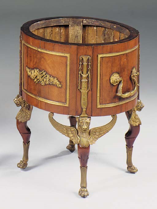 A FRENCH EMPIRE REVIVAL MAHOGANY AND ORMOLU MOUNTED CIRCULAR JARDINIERE