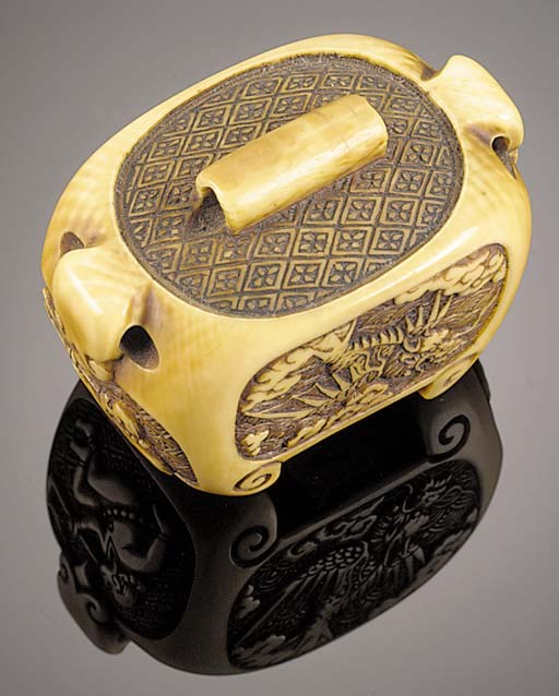 An ivory netsuke carved with panels of European figures
19th Century