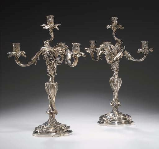 A pair of French silver four-light candelabra