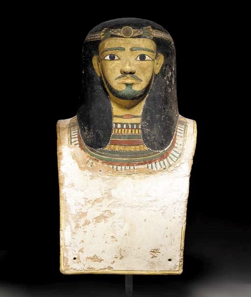 AN EGYPTIAN CARTONNAGE BUST FROM A SARCOPHAGUS