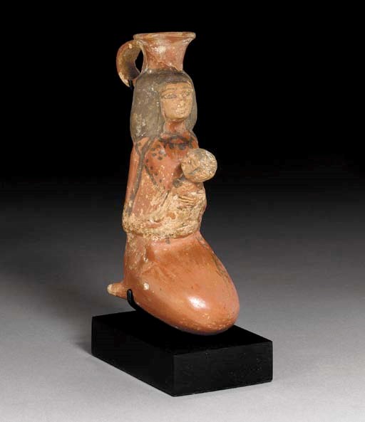 AN EGYPTIAN POTTERY ANTHROPOMORPHIC VASE
