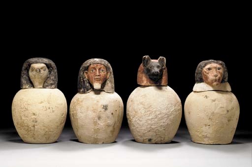 FOUR EGYPTIAN LIMESTONE CANOPIC JARS