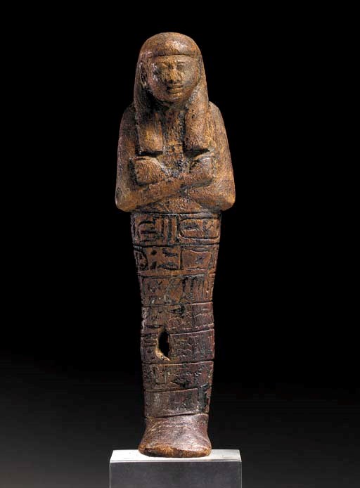 AN EGYPTIAN WOOD SHABTI FOR SETY I