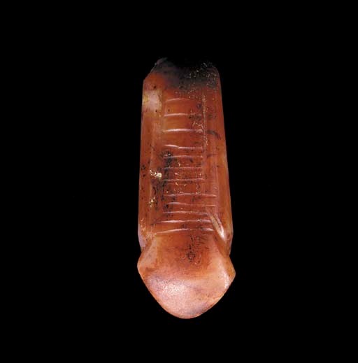 AN EGYPTIAN CARNELIAN URAEUS AMULET