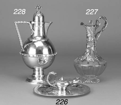 A LATE VICTORIAN SILVER JUG