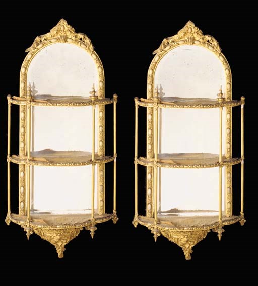 A MATCHED PAIR OF GILTWOOD AND GESSO THREE TIER HANGING SHELVES