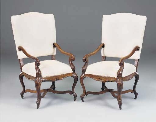 A pair of North European oak open armchairs, 19th century