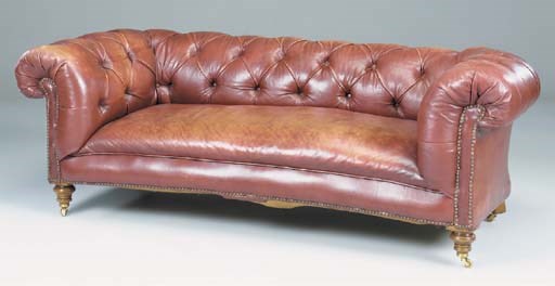 A VICTORIAN RED LEATHER UPHOLSTERED CHESTERFIELD SOFA
