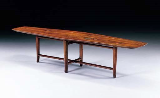 A WALNUT AND CERAMIC COFFEE TABLE