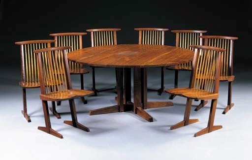 A WALNUT DINING TABLE AND EIGHT 'CONOID' CHAIRS