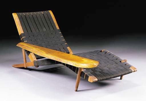 A WALNUT LOUNGE CHAIR
