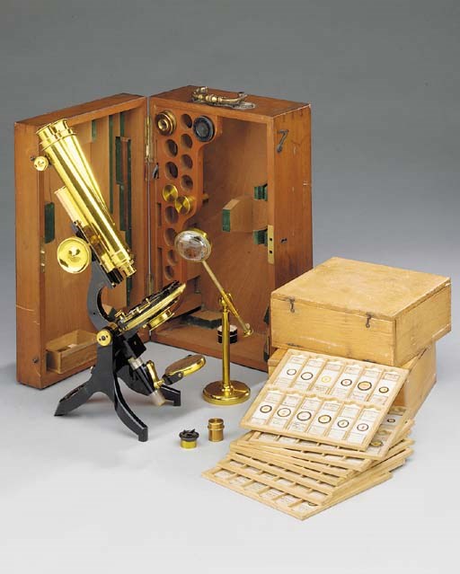 A late 19th-Century lacquered-brass and black enamelled compound monocular microscope,