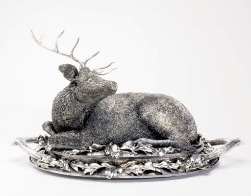 AN ITALIAN SILVER COVERED VENISON DISH