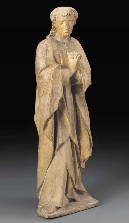 A FRENCH LIMESTONE FIGURE OF ST. JOHN THE EVANGELIST*