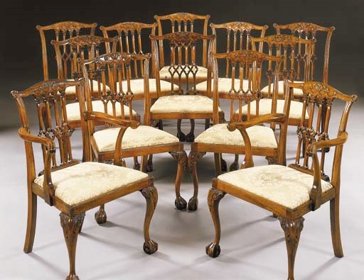 A SET OF TWELVE GEORGE III STYLE MAHOGANY DINING CHAIRS
