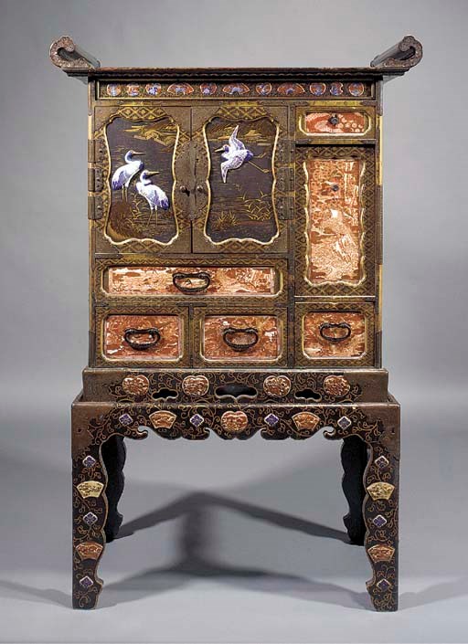 A Japanese lacquered wooden cabinet on stand with inset Kutani porcelain plaques
19th Century