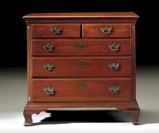 A CHIPPENDALE WALNUT CHEST-OF-DRAWERS