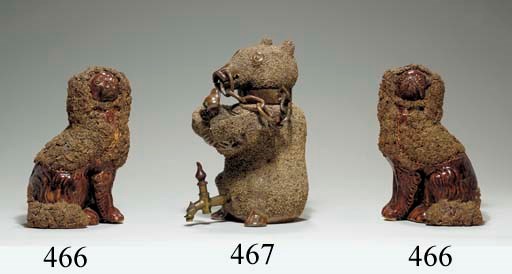 A NOTTINGHAM BROWN STONEWARE BEAR-BAITING CISTERN AND COVER