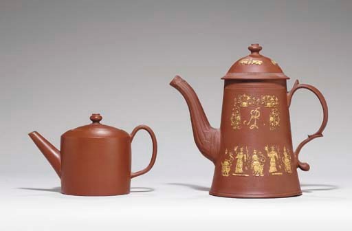 AN ENGLISH REDWARE LIGHTHOUSE COFFEE-POT AND COVER AND A TEAPOT AND COVER