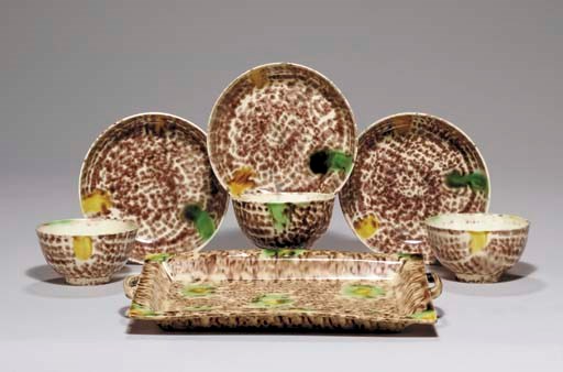 A STAFFORDSHIRE CREAMWARE TRAY, THREE TEABOWLS AND SAUCERS