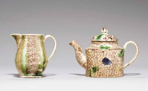 A STAFFORDSHIRE CREAMWARE TEAPOT AND COVER AND A PEARLWARE CREAM-JUG
