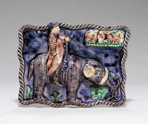 A STAFFORDSHIRE CREAMWARE PLAQUE OF A TURK RIDING AN ELEPHANT