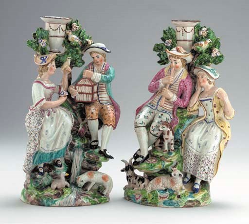 A PAIR OF STAFFORDSHIRE (RALPH WOOD) PEARLWARE BOCAGE CANDLESTICK GROUPS