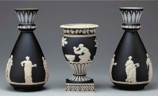 A WEDGWOOD BLACK JASPER DIP VASE AND A SIMILAR PAIR OF ENGLISH VASES