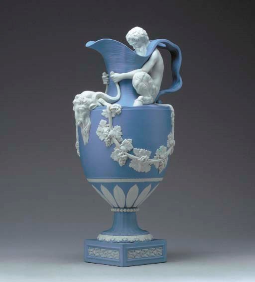 A WEDGWOOD BLUE JASPER EWER EMBLEMATIC OF WINE, 'SACRED TO BACCHUS'
