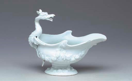 A BOW WHITE DRAGON-HANDLED SAUCEBOAT