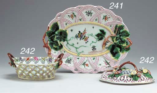 A WORCESTER PALE YELLOW-GROUND OVAL TWO-HANDLED RETICULATED BASKET