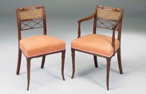 A SET OF EIGHT REGENCY MAHOGANY AND BRASS MOUNTED DINING CHAIRS, including a pair of armchairs