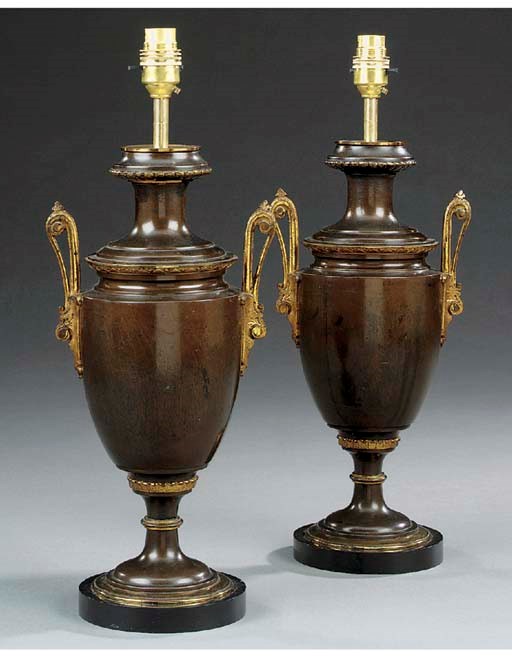 A pair of French parcel-gilt and patinated bronze table lamps, last quarter 19th century