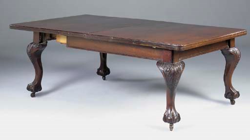 A late Victorian mahogany extending dining table