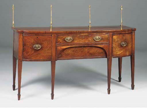 A George III mahogany and line inlaid bow front sideboard