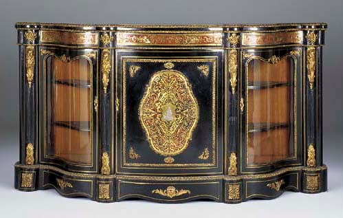 A Victorian ebonised and gilt metal mounted serpentine credenza