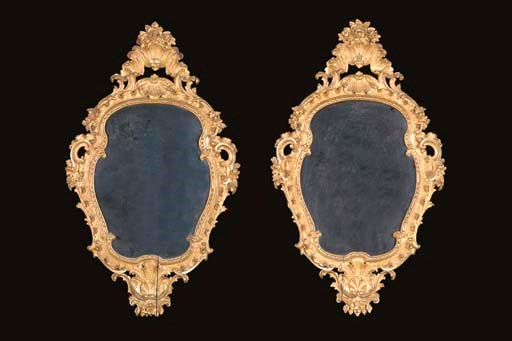 A pair of cartouche shaped, rococo giltwood mirrors, early 20th century