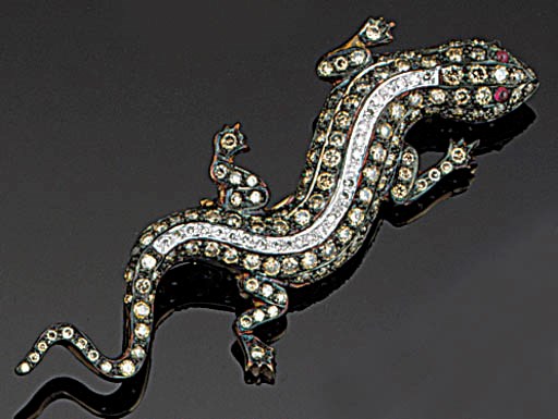 A diamond lizard brooch,