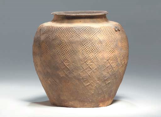An Impressed Grey Pottery Jar,