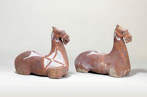 A Pair of Painted Grey Pottery Figures of Horses,