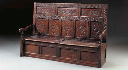 AN ENGLISH OAK AND ELM BOX SETTLE,