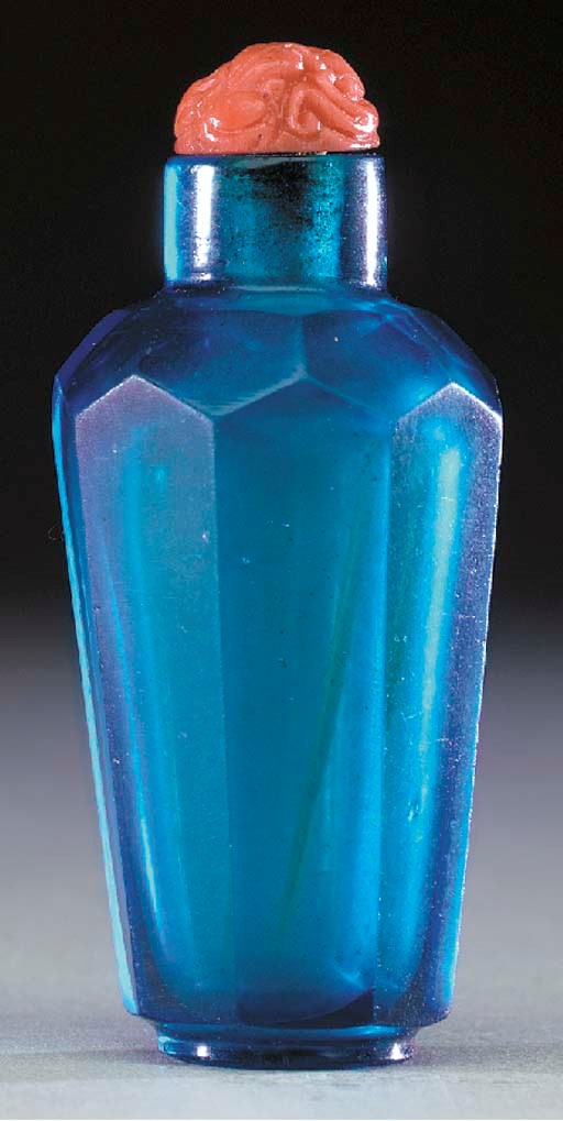 A RARE TRANSPARENT BLUE GLASS BOTTLE