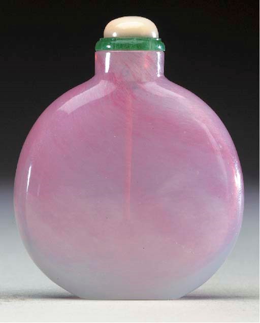 A SANDWICHED PINK AND WHITE GLASS BOTTLE