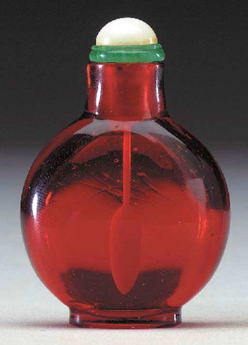 A MINIATURE RUBY-RED GLASS BOTTLE