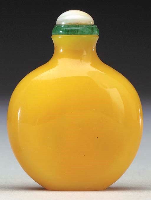 AN IMPERIAL-YELLOW GLASS BOTTLE