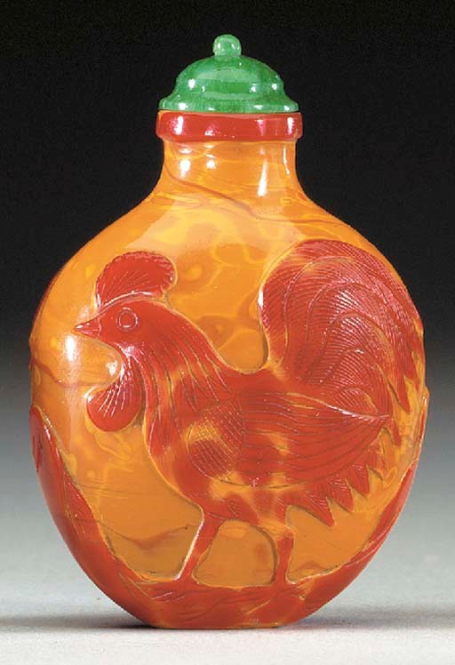 A CARVED REALGAR GLASS BOTTLE