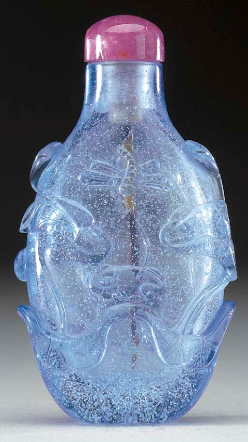 A FINE CARVED PALE BLUE GLASS BOTTLE